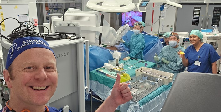 Alastair Lamb in a Guys’ Hospital surgical theatre with the da Vinci robot team